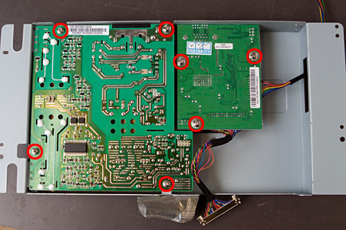 figure 10: remove the 7 screws holding the two PCBs to the metal bracket