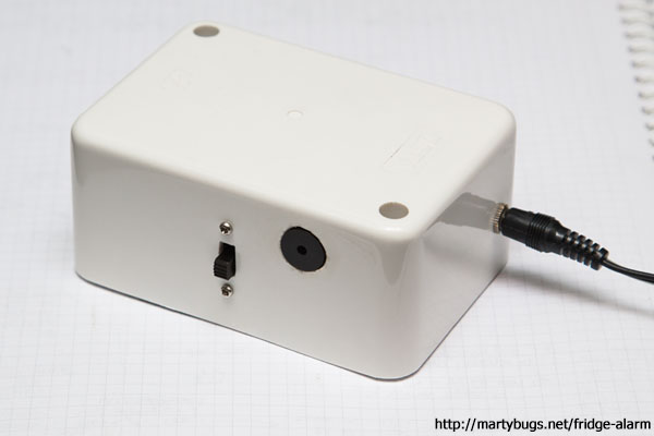 completed device - with light-dependent resistor plugged in on the right, power switch (left) and piezo buzzer (centre)