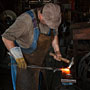 blacksmith shaping hot metal