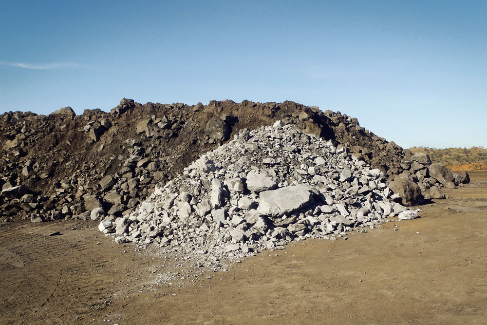 low-grade ore (light) and higher-grade ore (darker at rear)